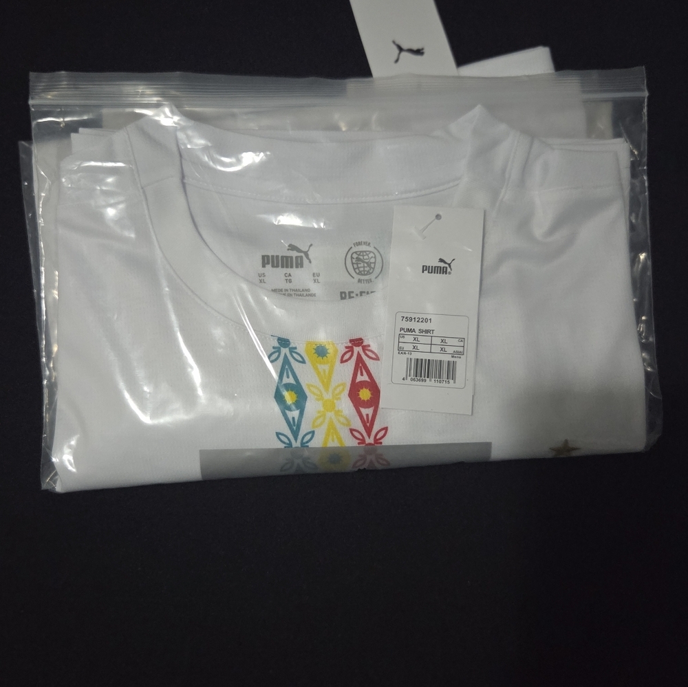 Puma White Tee with Red Yellow and Teal Floral Motif